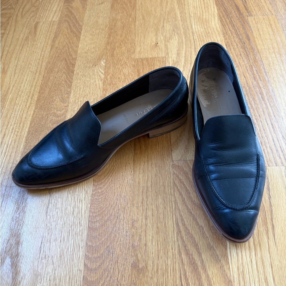 Everlane black leather loafers with brown accent